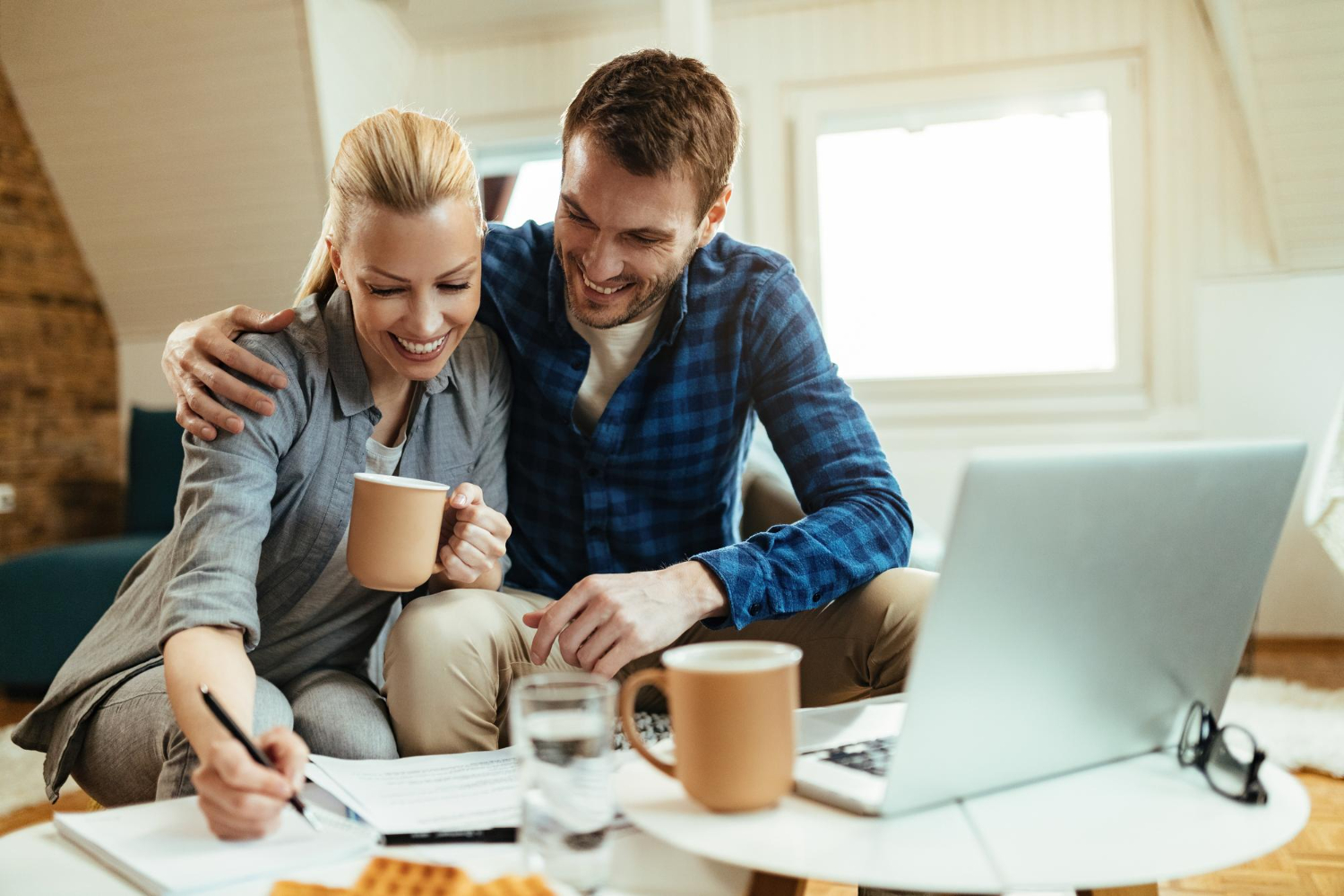 Homebuyer reviewing financial documents to calculate loan-to-value ratio.